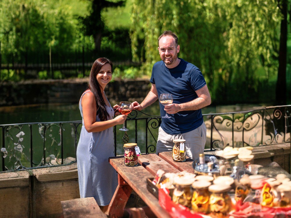 fruitanicals owners holding drinks with garnish