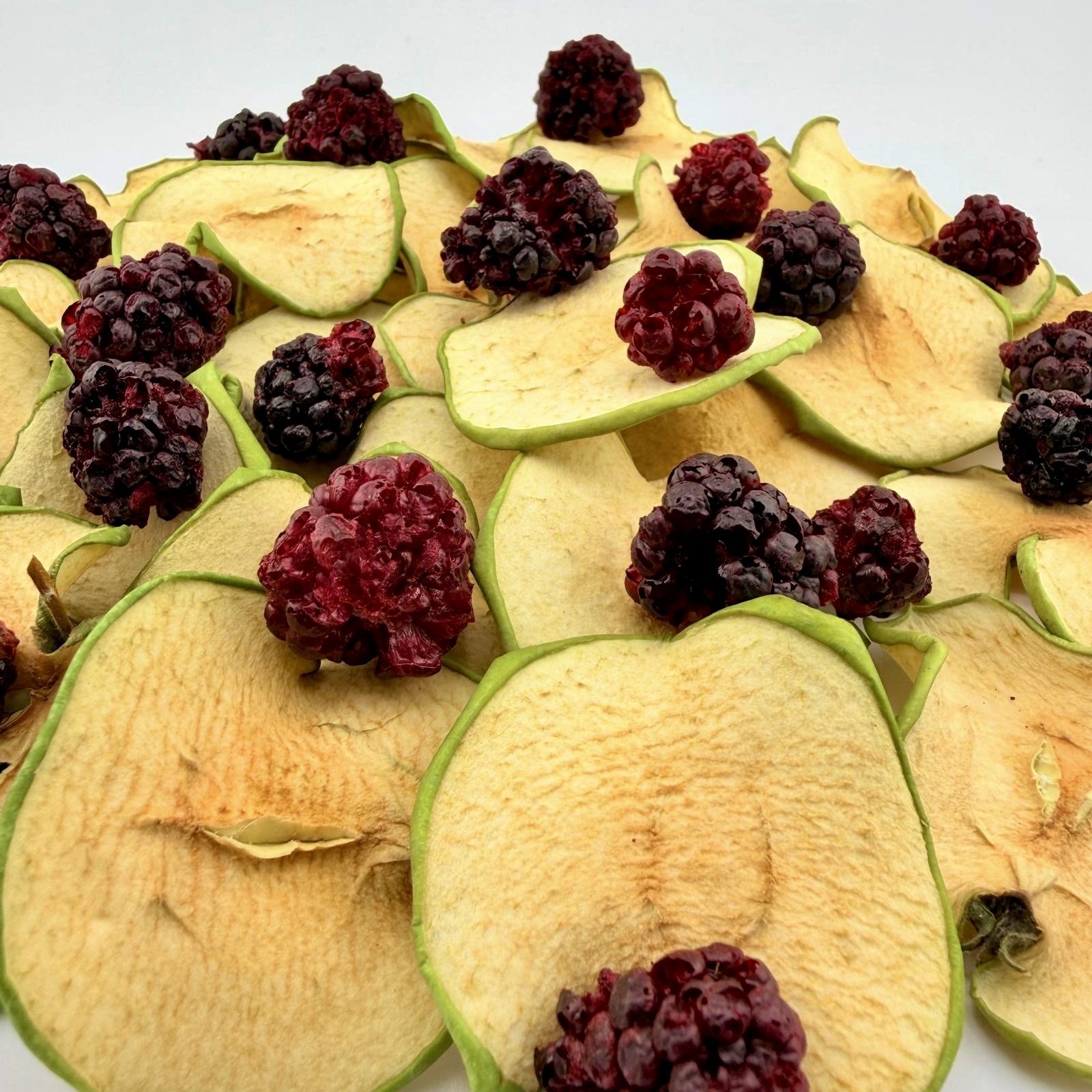 Close up of dehydrated apple and blackberry drink garnish